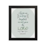 Christian wall art featuring Joshua 24:15 Bible verse on a gray and white background with gray design and green font and black framed hung on the wall