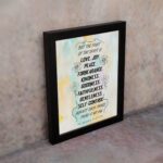 Fruit of the Spirit Bible verse wall art with black text and pastel watercolor background, Galatians 5:22-23. displayed on the wall in a black frame