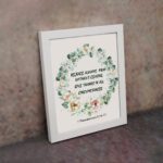 Rejoice always, pray without ceasing, give thanks in all circumstances 1 Thessalonians 5:16-17 Bible Wall Art with delicate floral wreath in pastel colors, light cream background displayed on the wall in a white frame