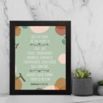 Christian wall art with Galatians 5:22-23 Bible verse on a light green background with light pink, brown, and green leaf design and black frame on the wall