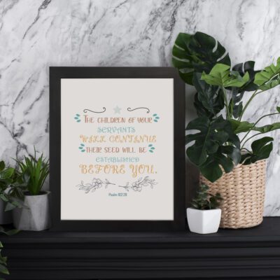 Christian wall art with Psalm 102:28 verse, featuring pastel colors, decorative fonts, and floral accents on a beige background displayed on the table in a black frame