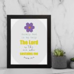 Psalm 54:4 Bible verse wall art with bold yellow text, purple flower, and light grey circular background pattern. displayed on the wall in a black frame