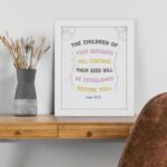 Psalm 102:28 Christian wall art with pastel colors, floral accents, and elegant design. displayed on the table in a white frame