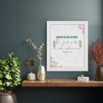 Psalm 54:4 Bible verse wall art with floral accents, green and red text, and a white background. displayed on the wall in a white frame