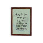 Christian wall art with Psalm 115:14 Bible verse on a light green and gray background with black font and brown frame displayed on the floor