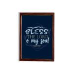 Infidu wall art featuring Bless The Lord O My Soul Psalm 103:1 in gold and white text on a dark blue background with decorative leaves. hung on the wall in a brown frame