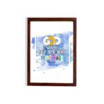 God Is Within Her She Will Not Fall Psalm 46:5 Bible Verse Wall Art with bright colors and watercolor background hung on the wall in a brown frame