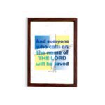 Acts 2:21 Bible Verse Wall Art with bold fonts and light blue highlights on "The Lord" against a textured white and yellow background. hung on the wall in a brown frame