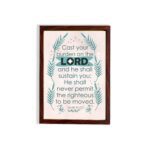 Cast Your Burden on the Lord Psalm 55:22 Christian Wall Art with palm leaf accents and turquoise text on a beige background. hung on the wall in a brown frame