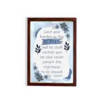 Christian wall art featuring Psalm 55:22 with navy blue text on a light blue and white background, decorated with blue flowers. hung on the wall in a brown frame