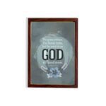 Isaiah 40:8 Christian wall art with light gray and white text on a muted blue background, featuring "GOD" in bold letters. hung on the wall in a brown frame