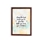 Christian wall art featuring Psalm 115:14 in black cursive on a pastel watercolor background with floral designs. hung on the wall in a brown frame