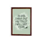 In God I Have Put My Trust, I Will Not Fear Psalm 56:4 bold Christian wall art with green background and brushstroke lettering hung on the wall in a brown frame