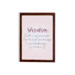 Christian wall art with the quote from Proverbs 2:6, featuring the word "Wisdom" in script on a soft pink background. hung on the wall in a brown frame