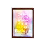 Christian wall art with Psalm 63:3, bold text in playful font, vibrant yellow, pink, and purple gradient on a warm background with a black frame. hung on the wall in a brown frame