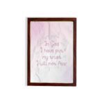 Christian wall art featuring Psalm 56:4, with soft pink background and elegant script font. Perfect for home decor. hung on the wall in a brown frame