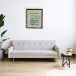 Christian wall art with Psalm 115:14 Bible verse on a light green and gray background with black font and brown frame hung on the wall above the sofa