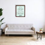 Wall art displaying Psalm 113:3 with elegant cursive font and leafy motifs on a mint green background. displayed on the wall in a brown frame