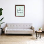 His Grace Is Enough Bible wall art with a mint background and teal script design, surrounded by decorative elements. displayed on the wall in a brown frame