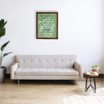 Christian wall art featuring Isaiah 40:8 with dark green and black text on a light green background. displayed on the wall in a brown frame