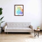 Bible wall art featuring Colossians 3:2 in cursive text on a colorful rainbow background. displayed on the wall in a brown frame