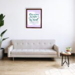 Christian wall art with Getting Wisdom Is The Wisest Thing You Can Do Proverbs 4:7, green text, light purple background, and decorative swirls. displayed on the wall in a brown frame