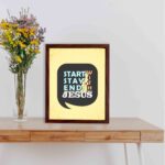 Bible wall art featuring Start With Jesus, Stay With Jesus, End With Jesus in a speech bubble shape with blue and white text on a light beige background. displayed on the table in a brown frame