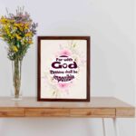 Floral watercolor 'For With God Nothing Shall Be Impossible' Luke 1:37 Bible verse wall art. displayed on the table in a brown frame