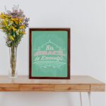 His Grace Is Enough Christian Wall Art with vintage typography on a mint green background displayed on the table in a brown frame