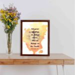 Set Your Affection on Things Above Colossians 3:2 Bible Verse Wall Art with subtle cross and watercolor background. displayed on the table in a brown frame