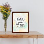 Christian wall art featuring Psalm 115:14 in black cursive on a pastel watercolor background with floral designs. displayed on the table in a brown frame