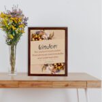 Proverbs 2:6 Christian Wall Art with "Wisdom" text, floral accents, and a beige background displayed on the table in a brown frame