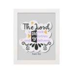 Bible wall art with The Lord Is My Rock, My Fortress, and My Deliverer in colorful pastel text on a light grey background with decorative elements. hung on the wall in a white frame