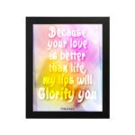 Christian wall art with Psalm 63:3, bold text in playful font, vibrant yellow, pink, and purple gradient on a warm background with a black frame. hung on the wall in a black frame