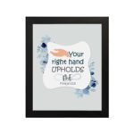 Your Right Hand Upholds Me Psalm 63:8 Christian wall art with a hand illustration and floral accents on a light gray background. hung on the wall in a black frame