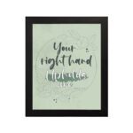 Your Right Hand Upholds Me Psalm 63:8 Christian wall art with dark gray text and light green floral elements on a pale green hung on the wall in a black frame background.