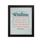 Wisdom Proverbs 2:6 Christian wall art with teal and red text on a mint green background in a black frame. hung on the wall in a black frame