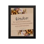 Proverbs 2:6 Christian Wall Art with "Wisdom" text, floral accents, and a beige background hung on the wall in a black frame