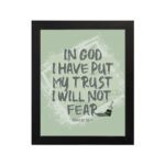 In God I Have Put My Trust, I Will Not Fear Psalm 56:4 bold Christian wall art with green background and brushstroke lettering hung on the wall in a black frame