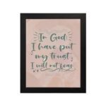 Wall art featuring the quote In God I Have Put My Trust I Will Not Fear from Psalm 56:4 in a bold, playful font. hung on the wall in a black frame