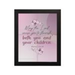 Christian wall art with the verse May The Lord Cause You To Flourish Both You And Your Children Psalm 115:14 in soft colors and floral design. hung on the wall in a black frame