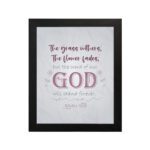 Christian wall art with the verse The Grass Withers, The Flower Fades But The Word Of Our God Will Stand Forever Isaiah 40:8. hung on the wall in a black frame