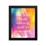 Wall art featuring the verse For with God nothing shall be impossible from Luke 1:37, designed with a colorful watercolor background. hung on the wall in a black frame