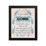 Cast Your Burden on the Lord Psalm 55:22 Christian Wall Art with palm leaf accents and turquoise text on a beige background. hung on the wall in a black frame