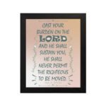 Cast Your Burden on the Lord Psalm 55:22 Bible verse wall art with teal lettering and soft peach background, Christian home decor. hung on the wall in a black frame