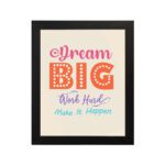 Infidu Dream Big Work Hard Make It Happen wall art with a light pink background and vibrant pink, orange, violet, and sky blue text and a black frame hung on the wall. Inspiring decor for home offices and workspaces.