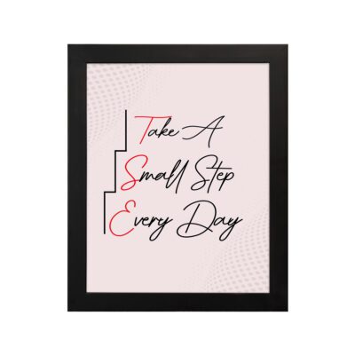 Infidu Take A Small Step Everyday wall art with a gray and light pink background black and red text and a black frame hung on the wall. Inspiring decor for any workspace.