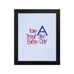 Infidu Take A Small Step Everyday wall art with a gray background navy blue and red text and a black frame hung on the wall. Inspiring decor for any workspace.