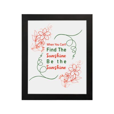 Infidu When You Can't Find The Sunshine Be The Sunshine wall art with a white background and red floral accents and black frame hung on the wall Inspiring decor for home offices.