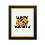 Inspirational quote wall art with "Believe In Yourself" on a white and yellow background and black framed on the wall. Perfect for motivating your workspace.